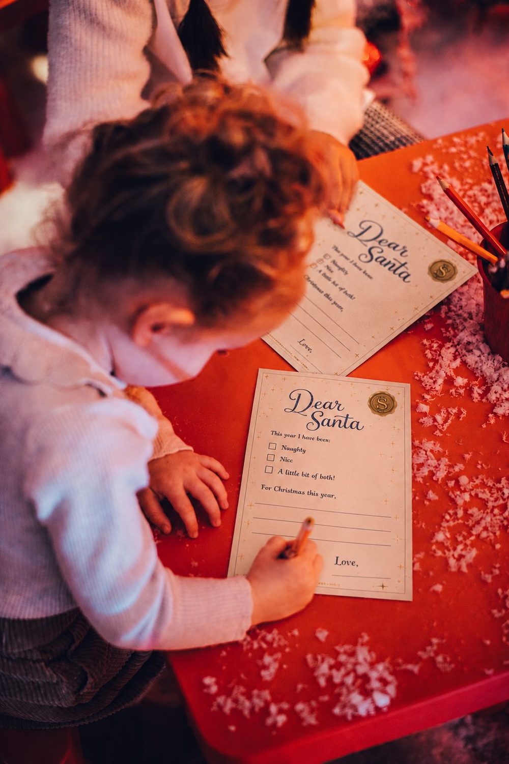A child writing their letter in the Wishing Nook